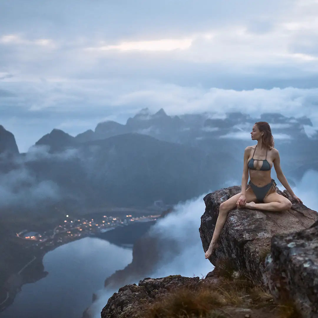 model wearing grey bikini photographed outdoors at the top of the mountain in Lofoen Norway