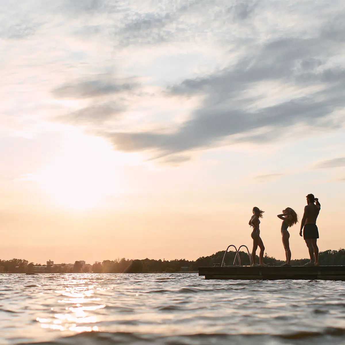 Ui Swim – Nordic designer swimwear photographed outdoors in sunset at the dock in Lauttasaari, Helsinki